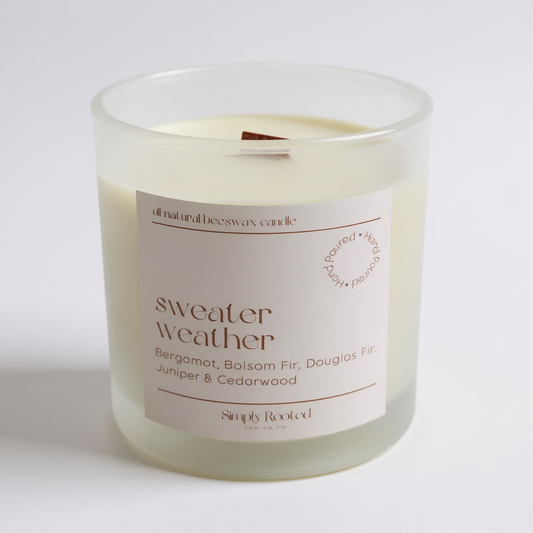 4 oz beeswax candle labeled 'sweater weather' with a white background